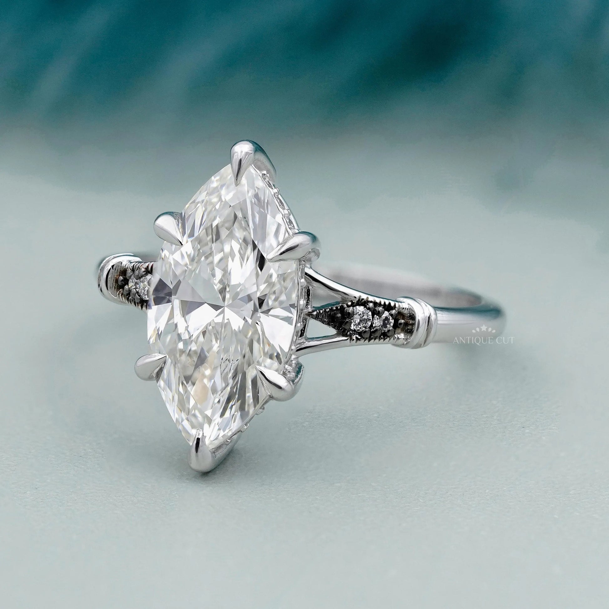 Vintage marquise engagement ring with hidden halo