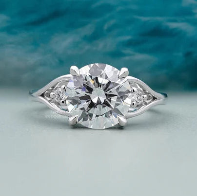 Round cut diamond engagement ring with side stones