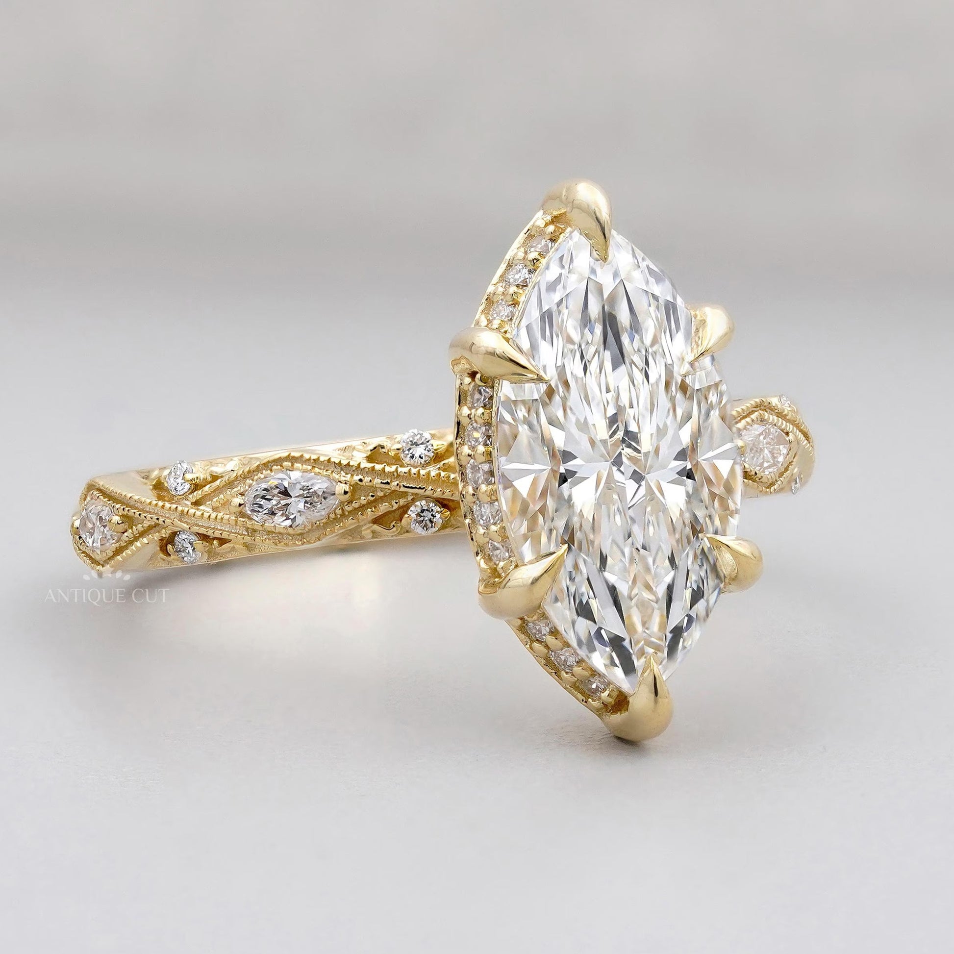 Vintage marquise diamond engagement ring with hidden halo