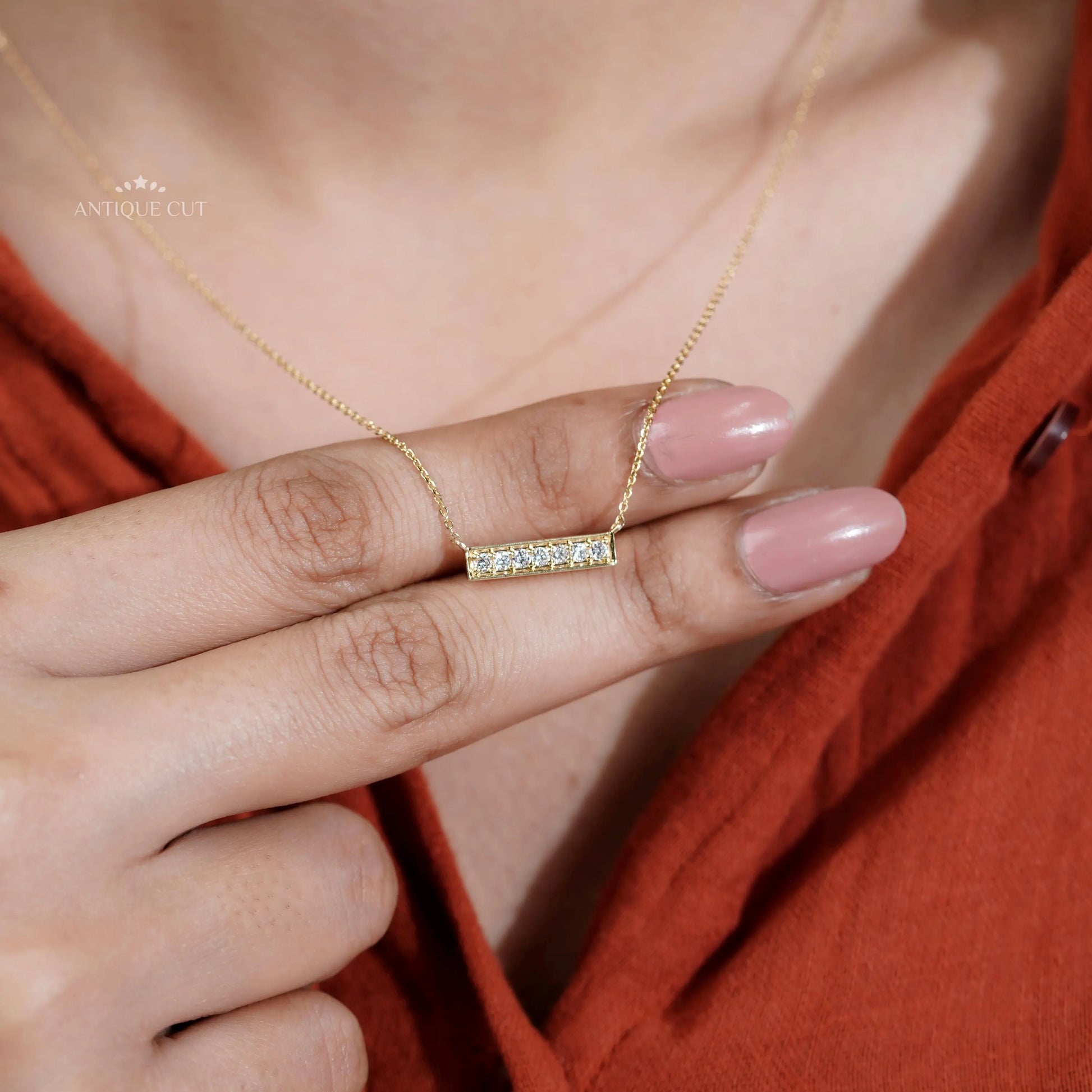 This gold diamond bar necklace is perfect for gifting.