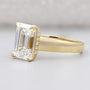 Yellow gold emerald cut engagement ring with hidden halo
