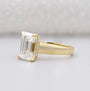 Yellow gold emerald cut engagement ring with hidden halo
