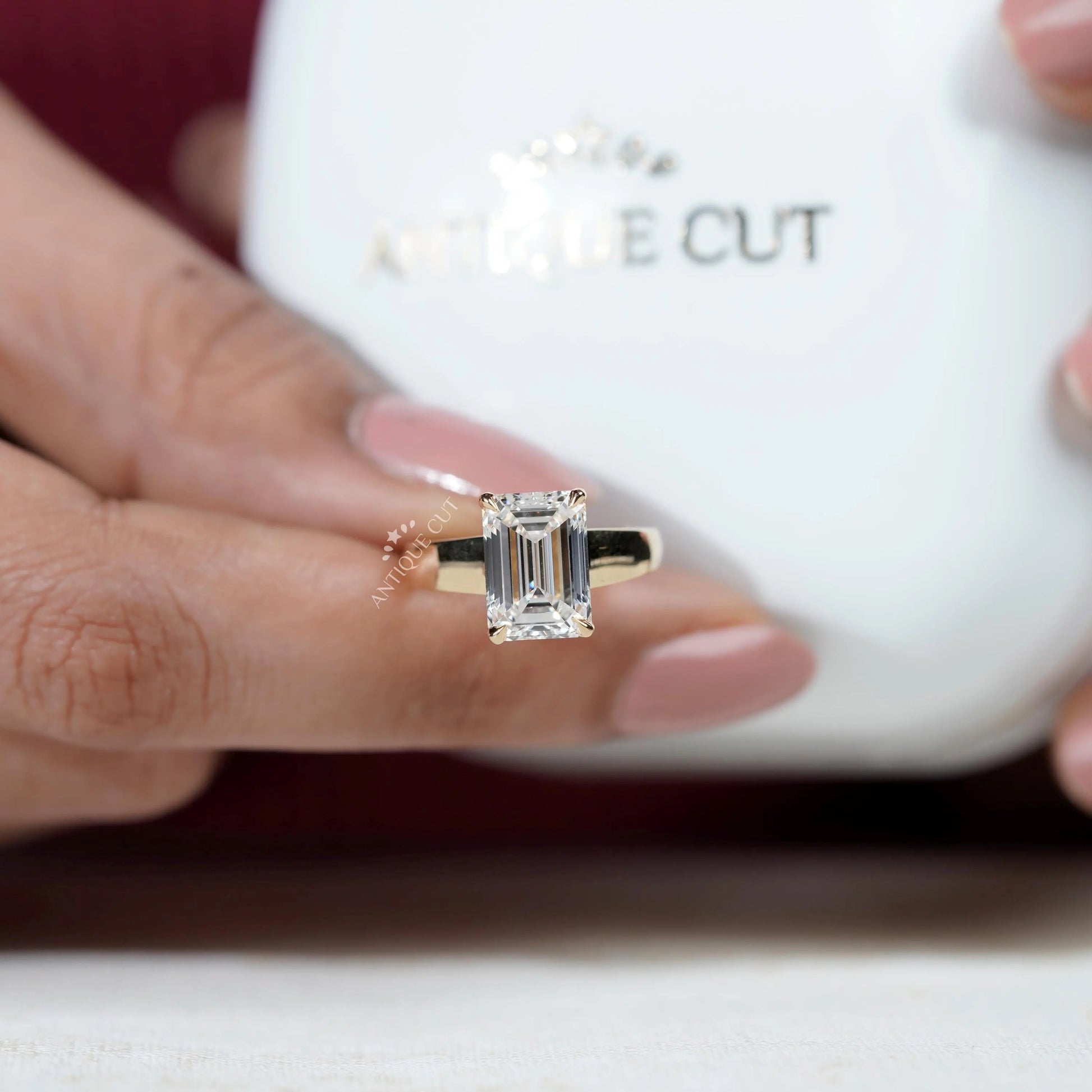 Classic emerald cut 4 prong diamond ring