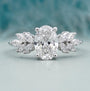 Oval cut diamond engagement ring with marquise side stones