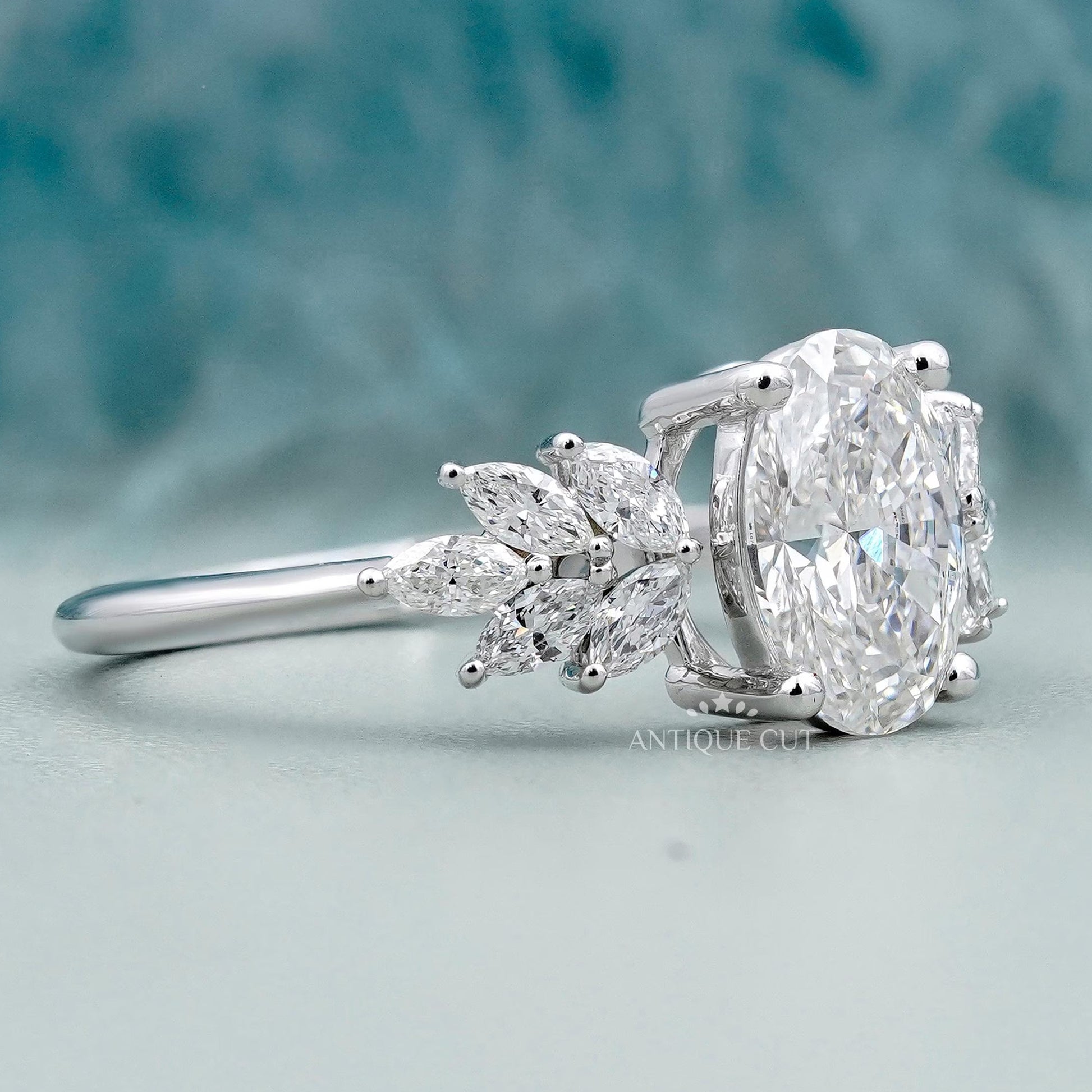 Oval lab grown diamond ring with marquise accents