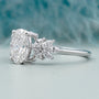 Oval center diamond engagement ring with side stones