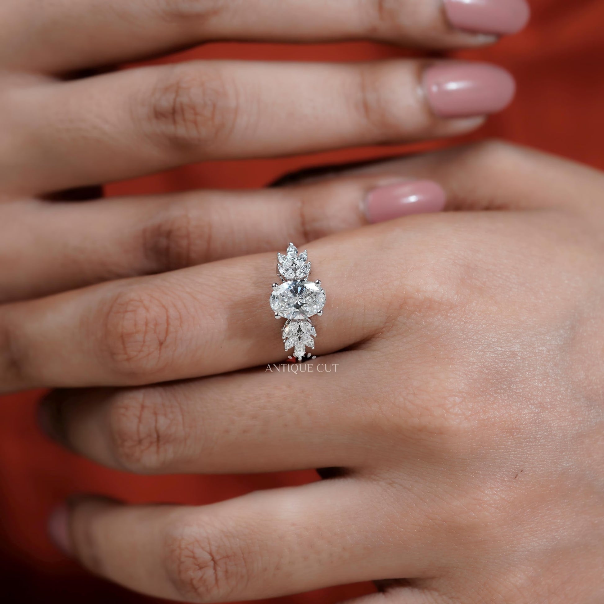 Diamond ring on a hand with a blurred background