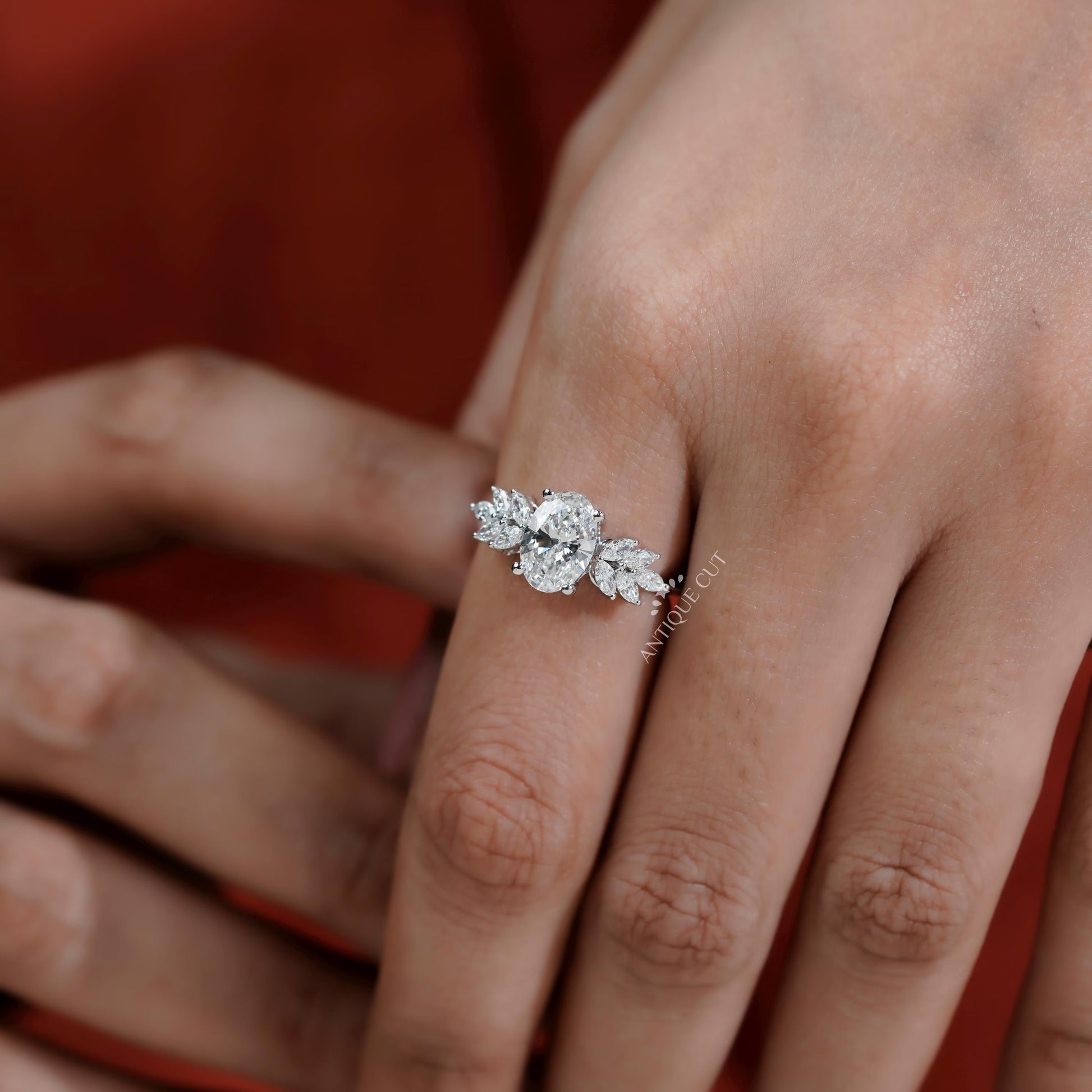 Diamond ring on a hand with a blurred background