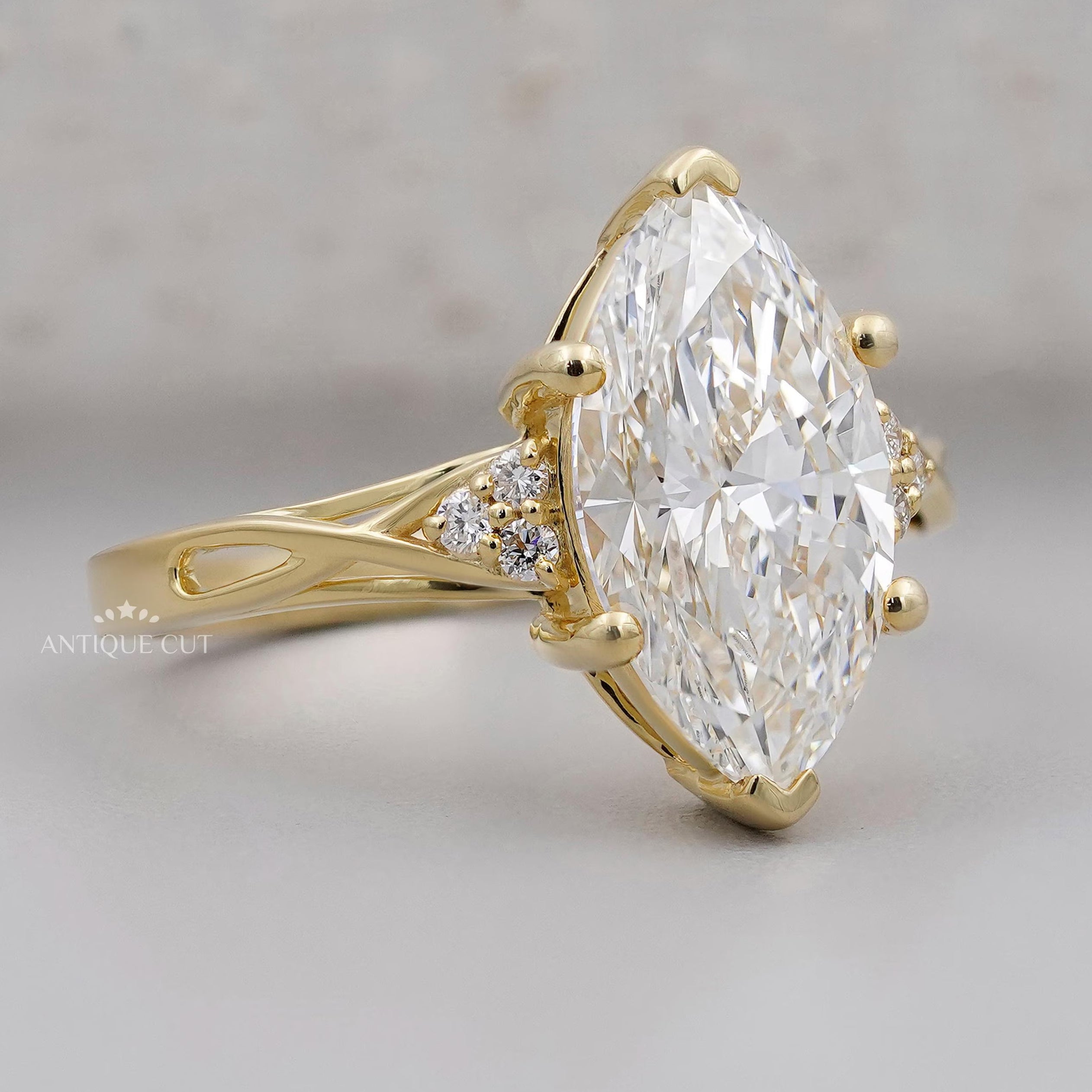 Lab grown marquise diamond engagement ring with side accents