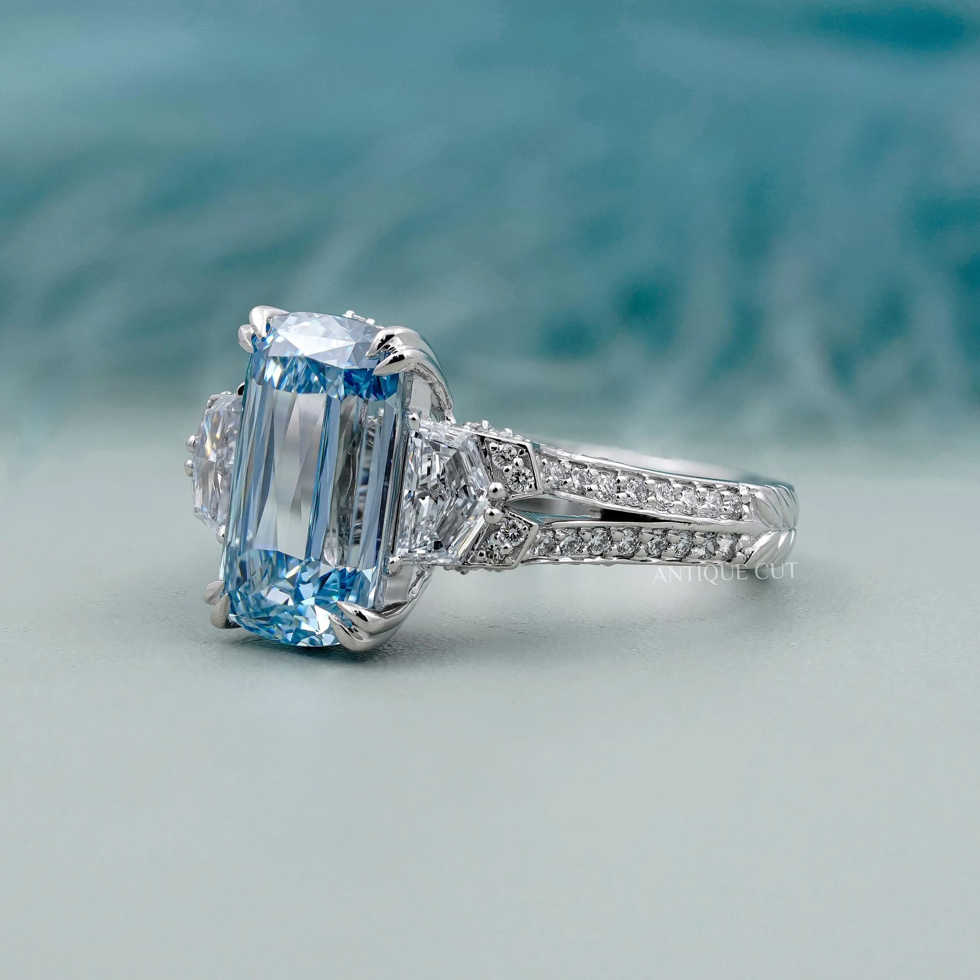 Platinum cushion blue diamond vintage ring design