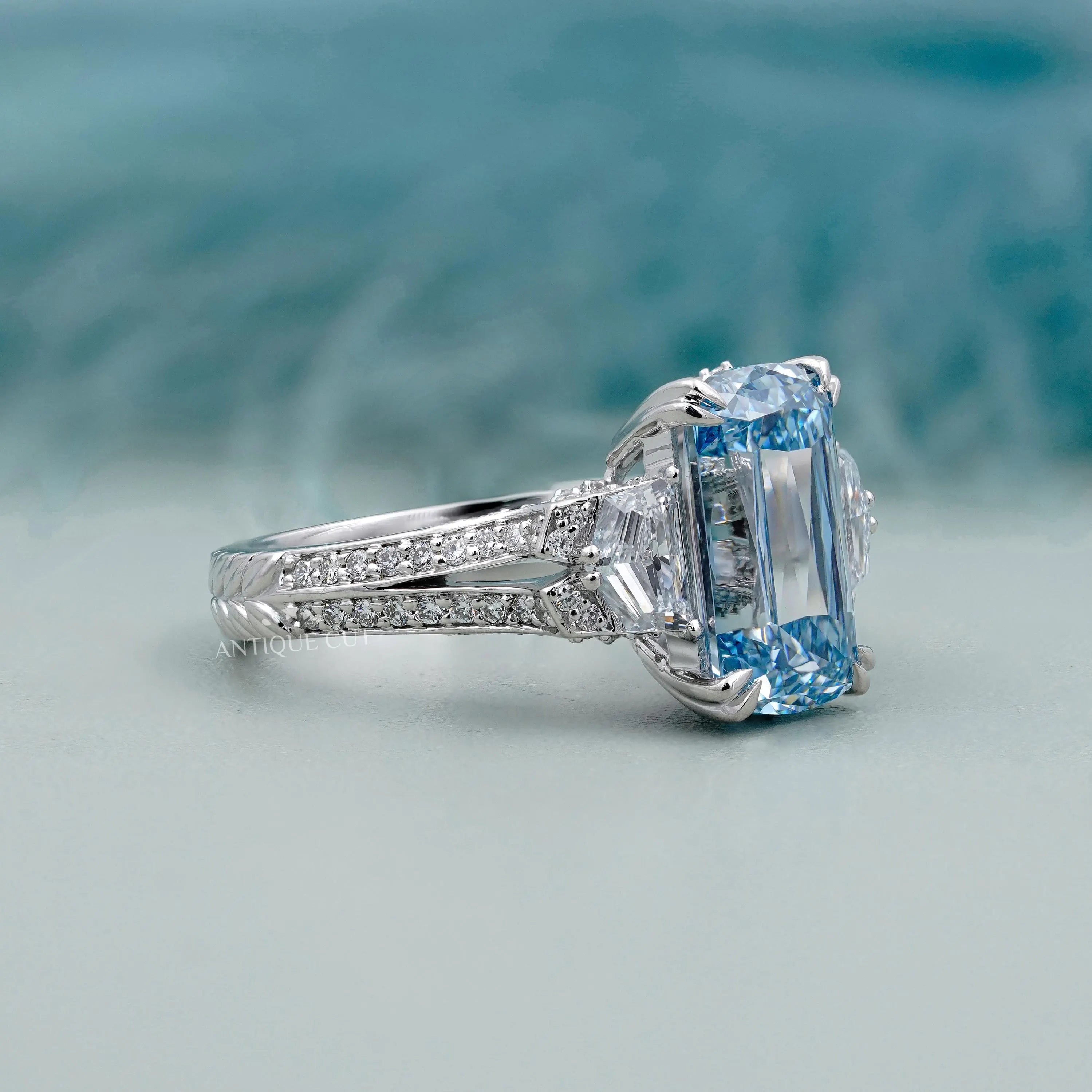 Cushion cut fancy blue diamond engagement ring with double prong setting