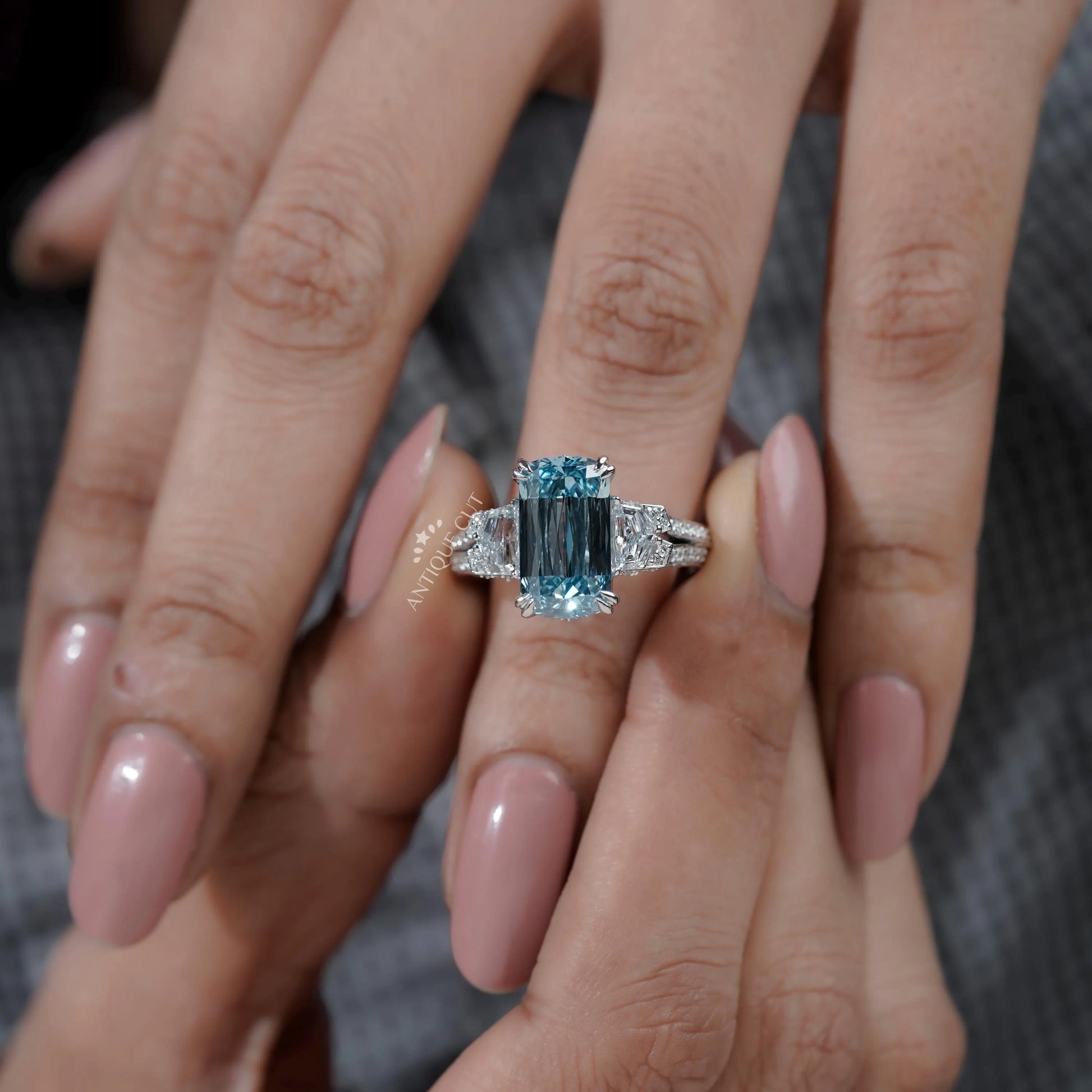 Lab grown blue cushion diamond ring with classic prong setting