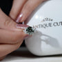 Timeless round green diamond engagement ring