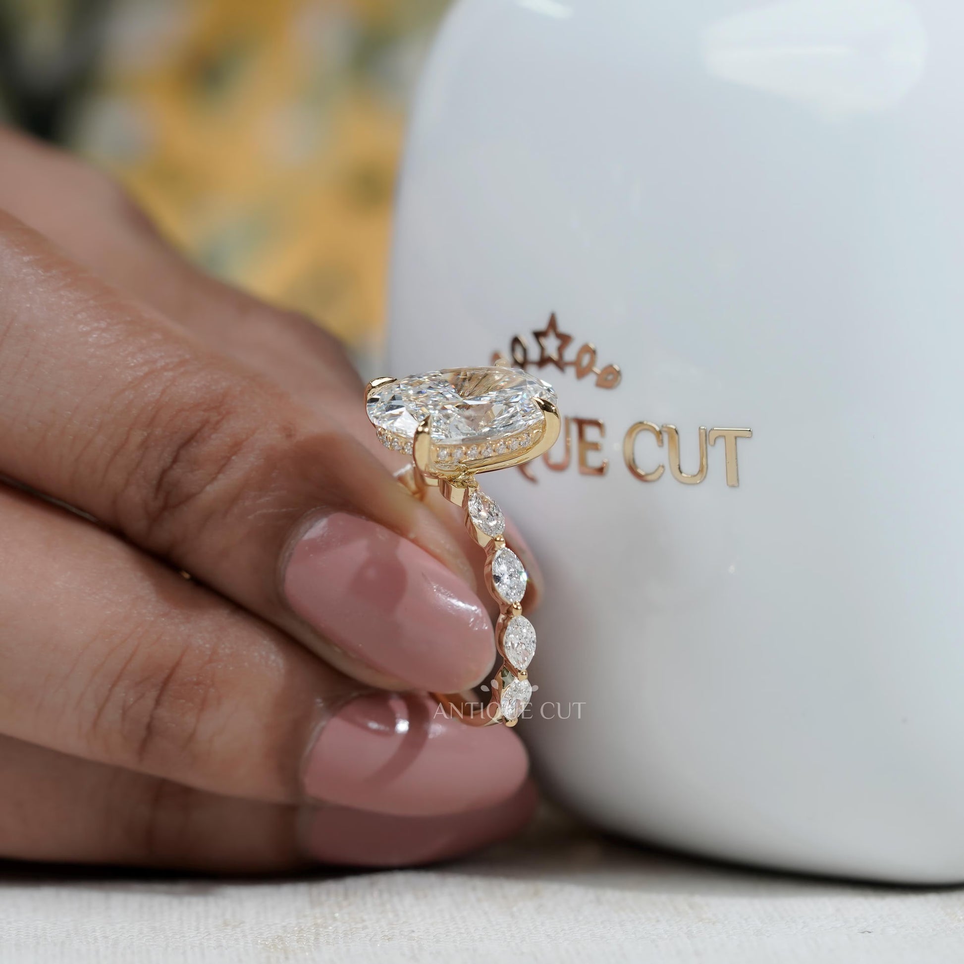 Oval Cut Diamond Engagement Ring with Hidden Halo & Marquise Side Stones