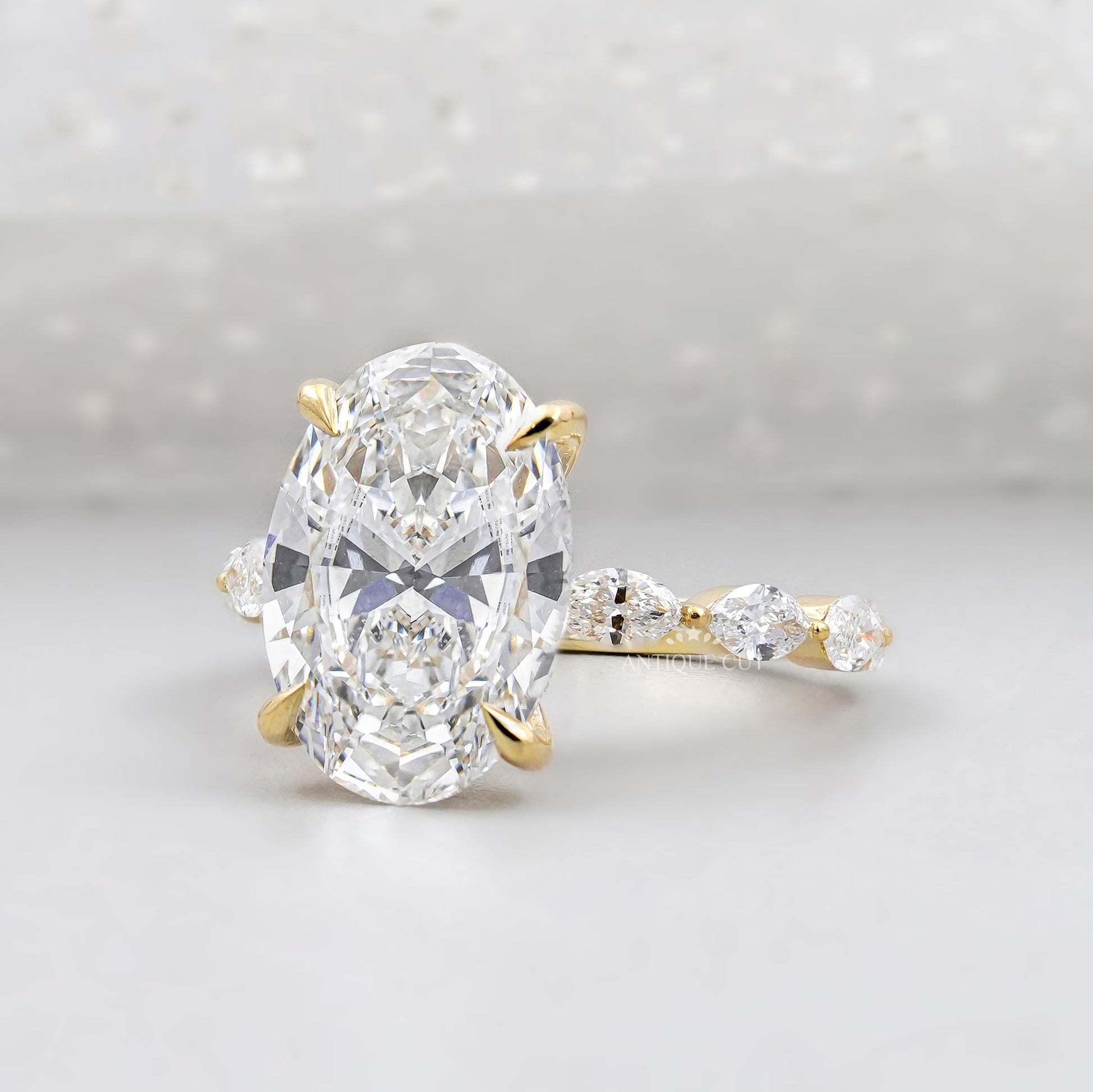 Oval Cut Diamond Engagement Ring with Hidden Halo & Marquise Side Stones