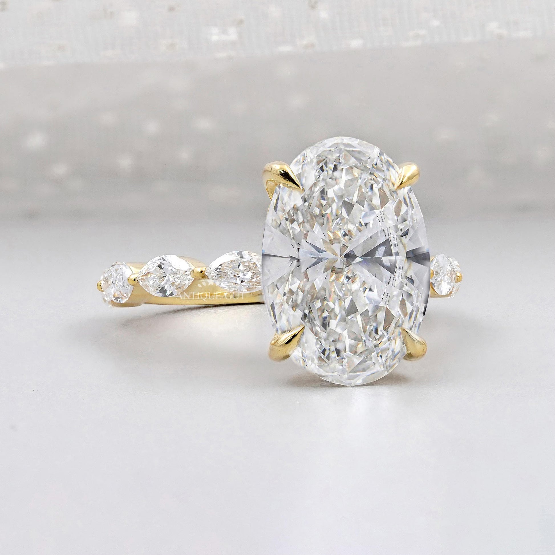 Oval Cut Diamond Engagement Ring with Hidden Halo & Marquise Side Stones