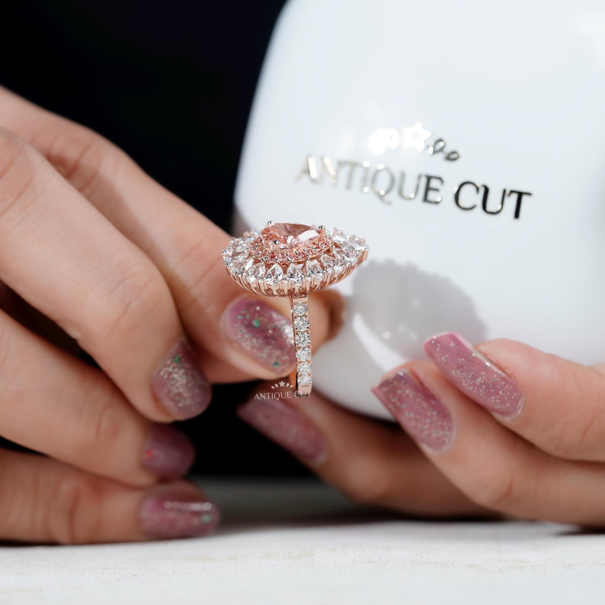 Lab grown pear pink diamond engagement ring with halo