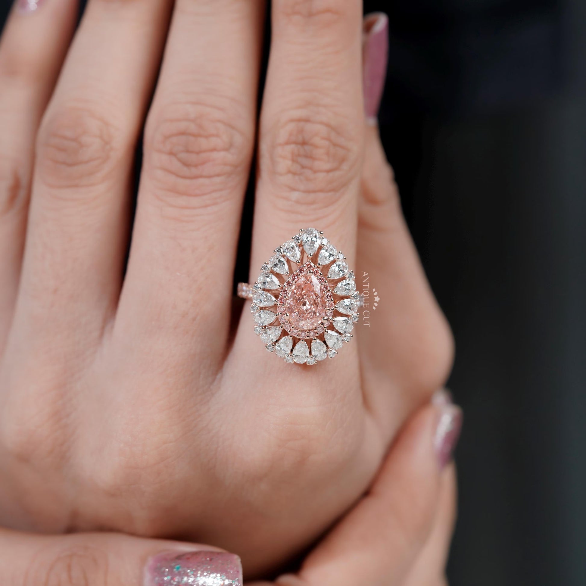 Sparkling pear pink diamond halo ring in rose gold