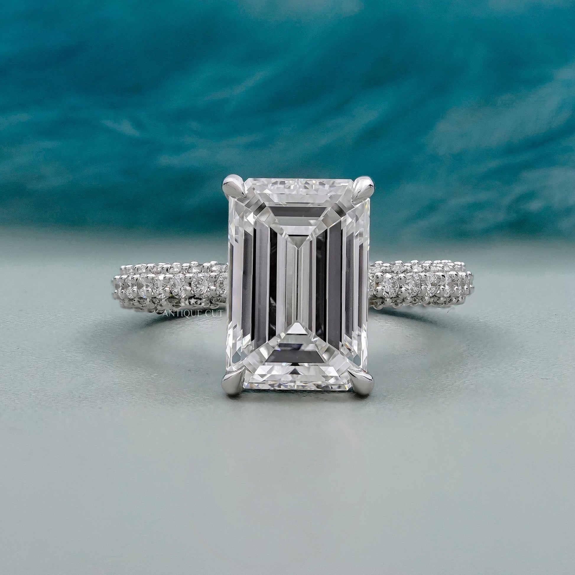 Emerald cut diamond ring with hidden halo in white gold