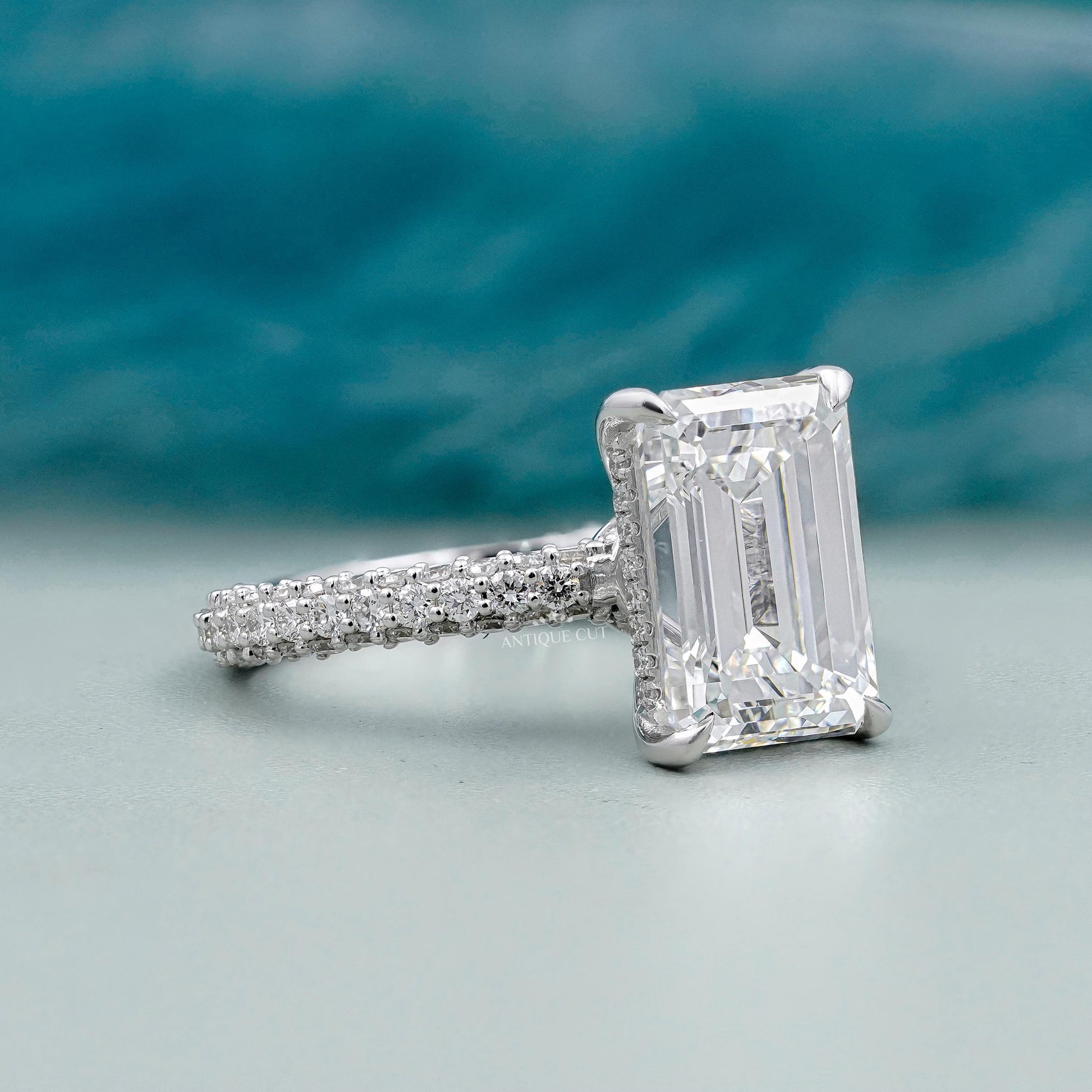 Antiquecut emerald cut ring three row pave band