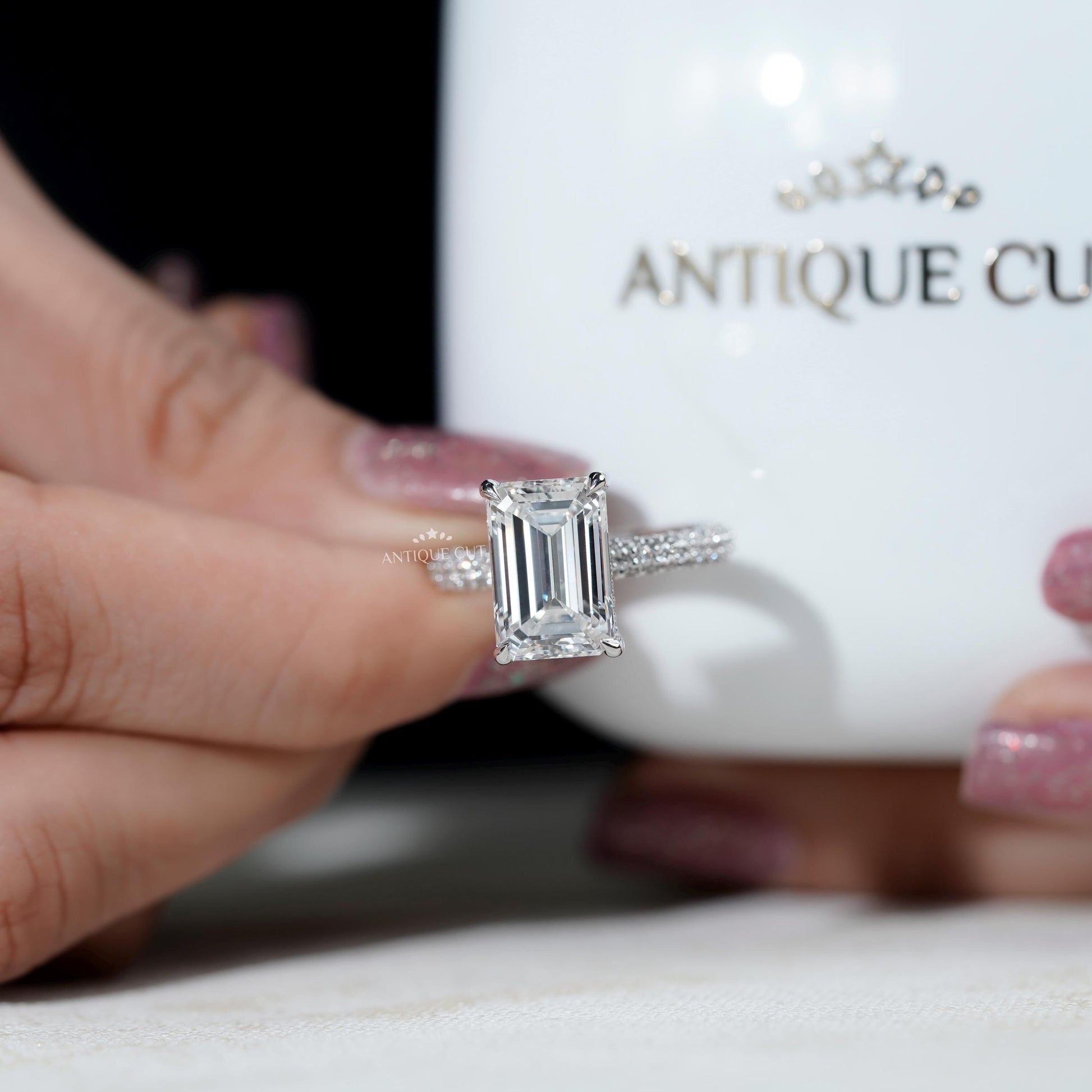 Three row pave emerald cut engagement ring 
