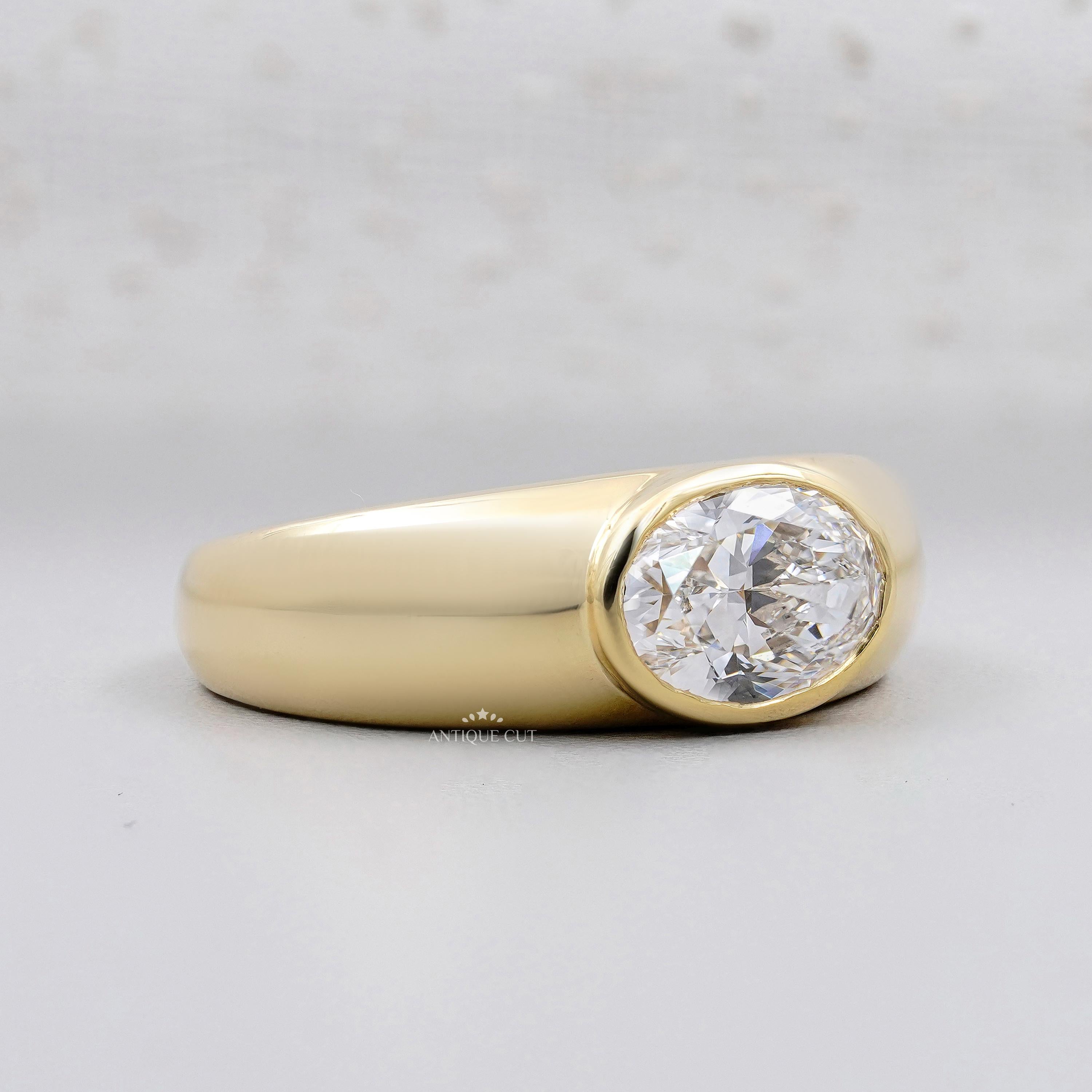 East West oval lab grown diamond engagement ring with bezel setting