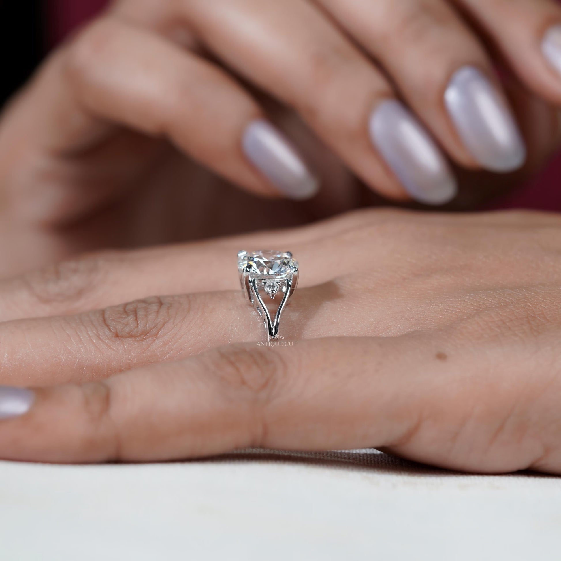 Round cut diamond ring white gold side view