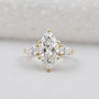 Marquise cut engagement ring in yellow gold three stone