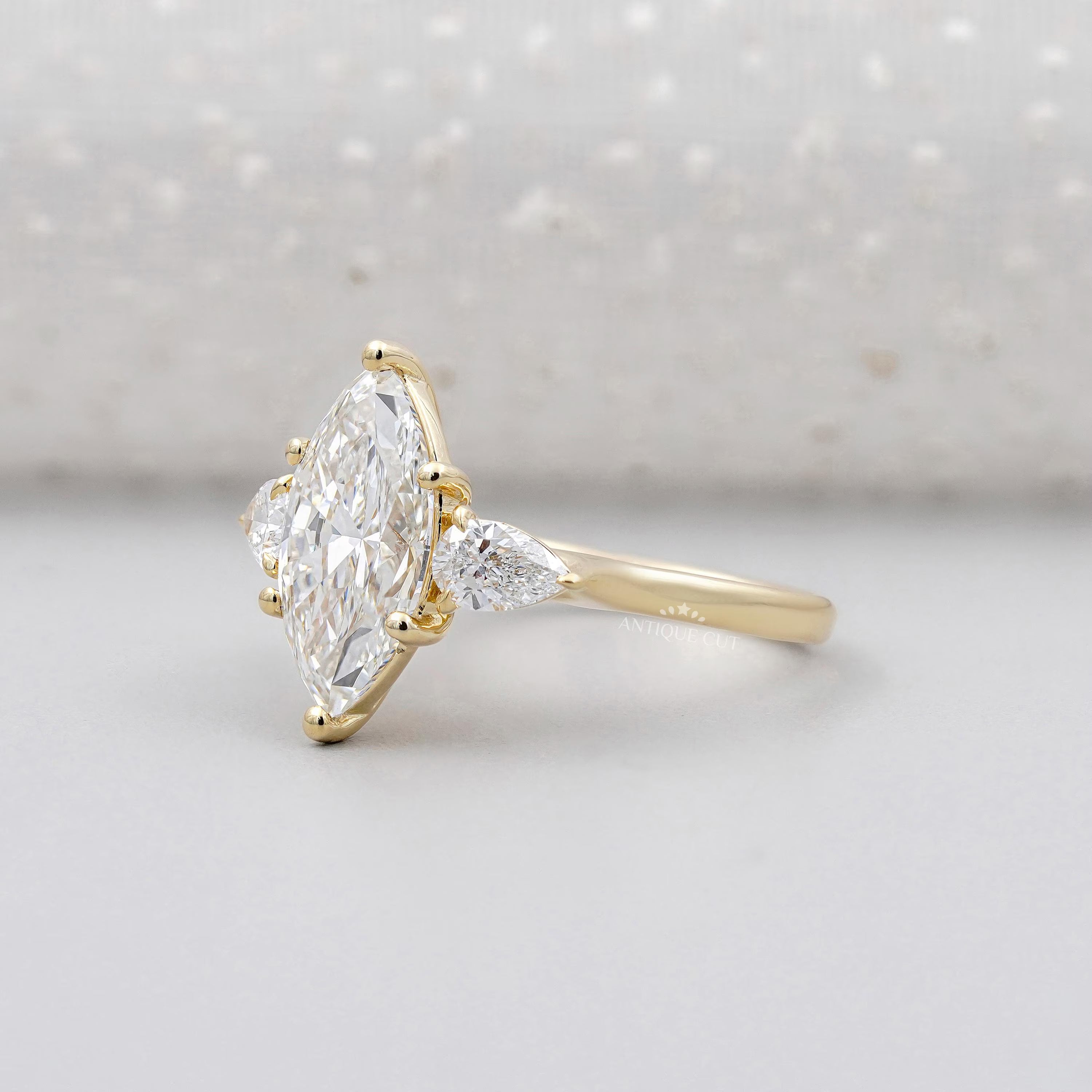 Lab grown marquise cut engagement ring three stone
