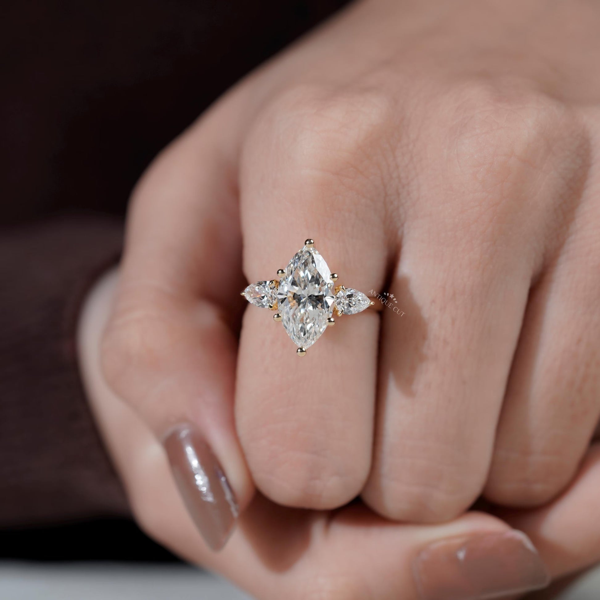 Marquise diamond ring side view with side stones