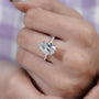 Pear diamond ring side view with round side stones
