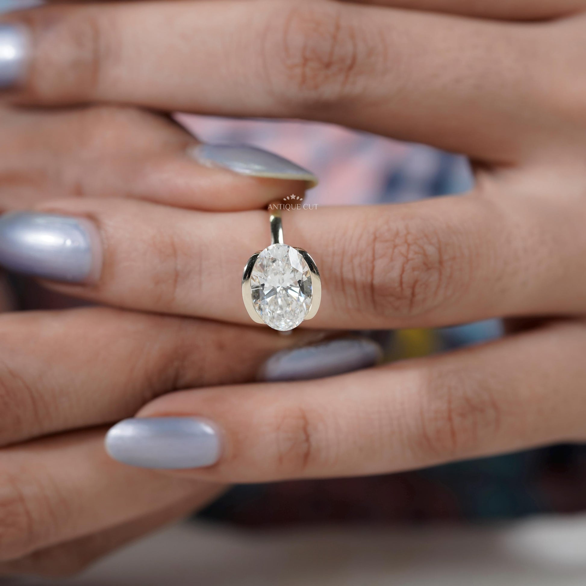 contemporary oval diamond ring east west