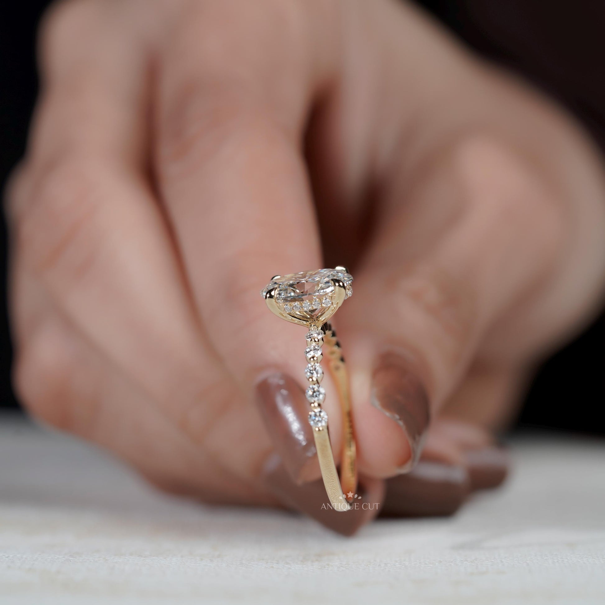 IGI certified oval diamond engagement ring with pave band
