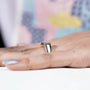 sleek bezel set emerald diamond ring