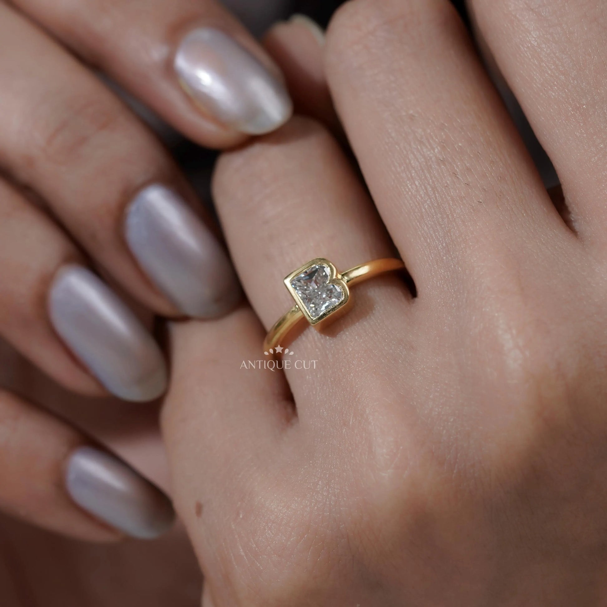 Letter B diamond solitaire engagement ring close-up