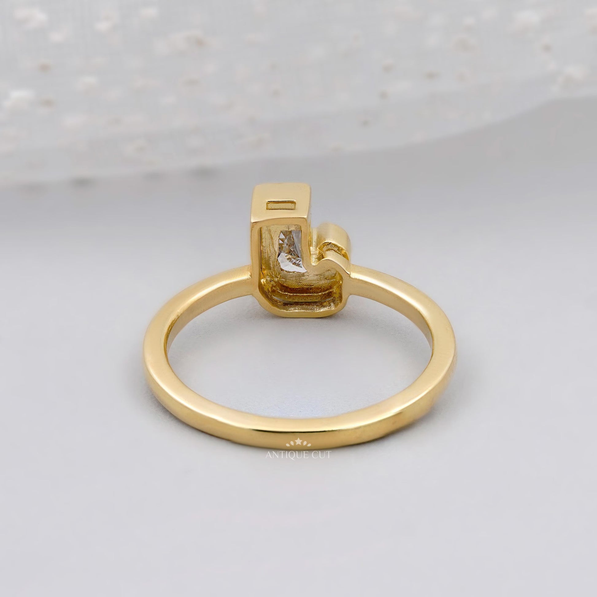 Bezel set J initial diamond ring close-up