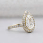 White gold pear engagement ring with pave band