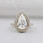 Pear shape engagement ring with halo diamond setting
