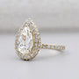Halo diamond ring with pear shaped center stone
