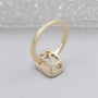 Emerald cut diamond ring with secure bezel set design