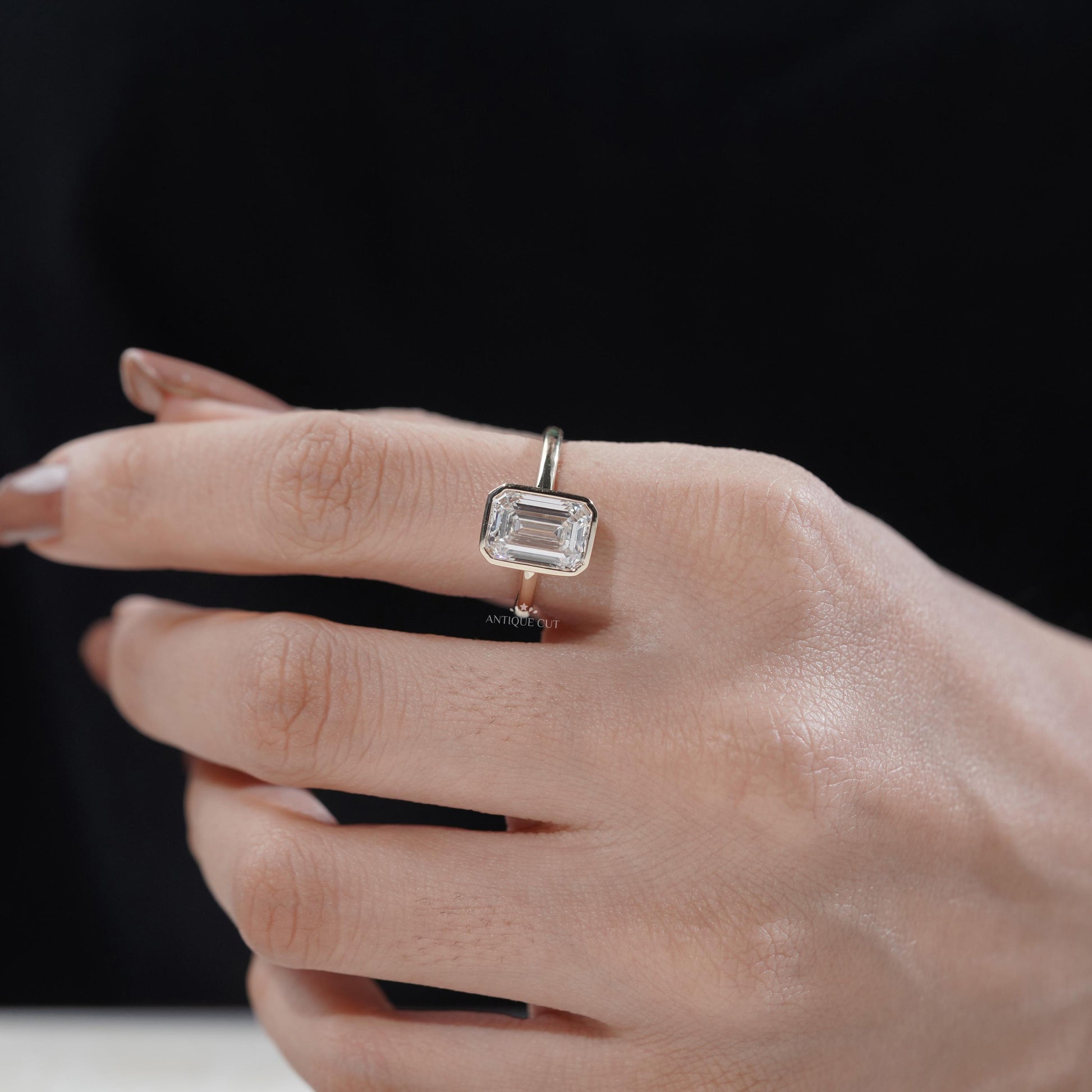 Luxury emerald engagement ring side view