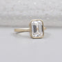 Yellow gold emerald ring with solitaire diamond