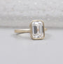 Emerald cut diamond bezel solitaire engagement ring in yellow gold