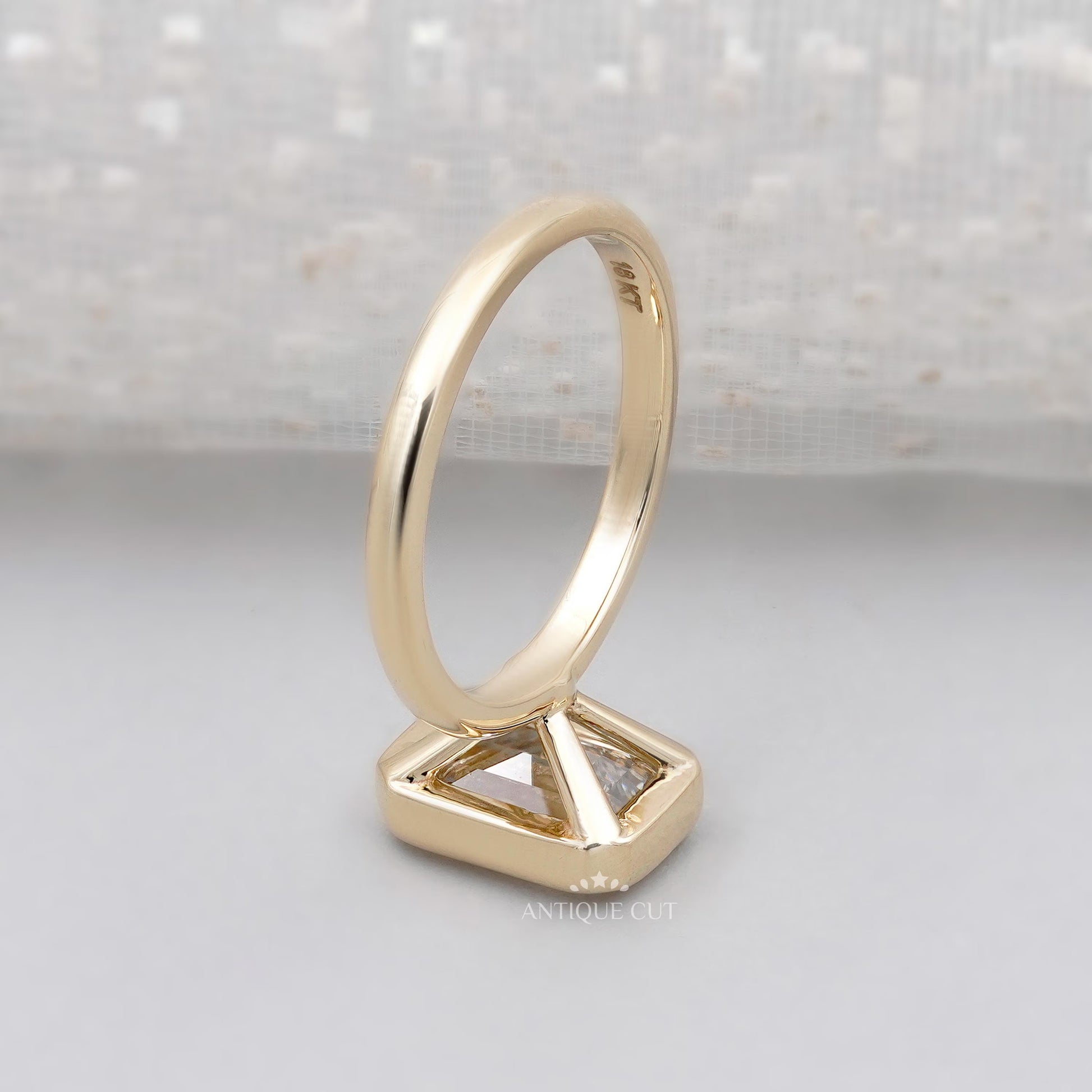 Antiquecut emerald cut engagement ring yellow gold