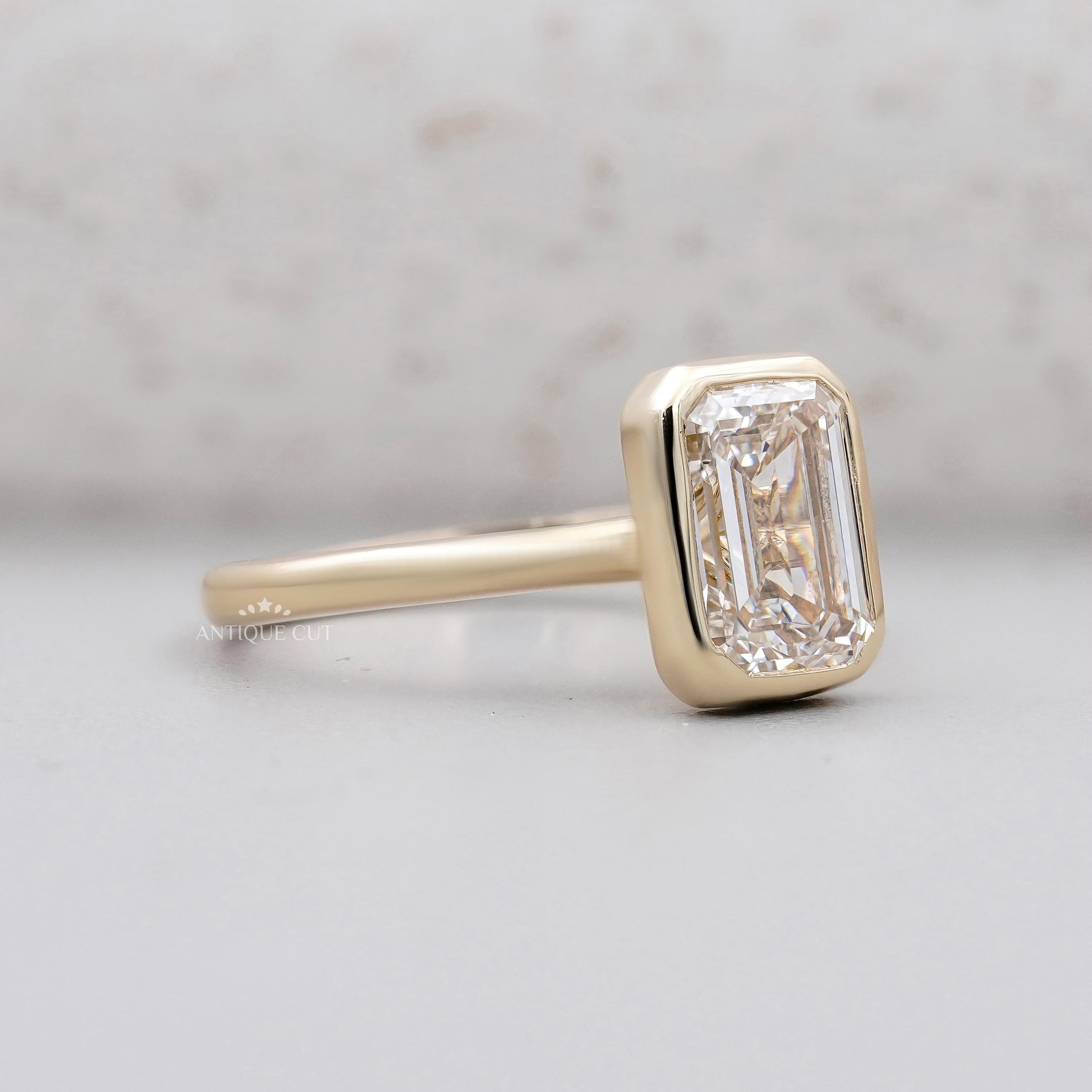 Lab grown emerald cut solitaire engagement ring