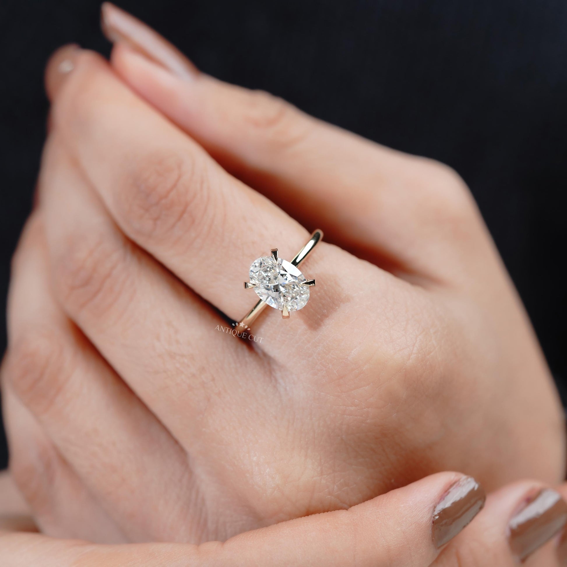 Yellow gold hidden halo oval ring top view