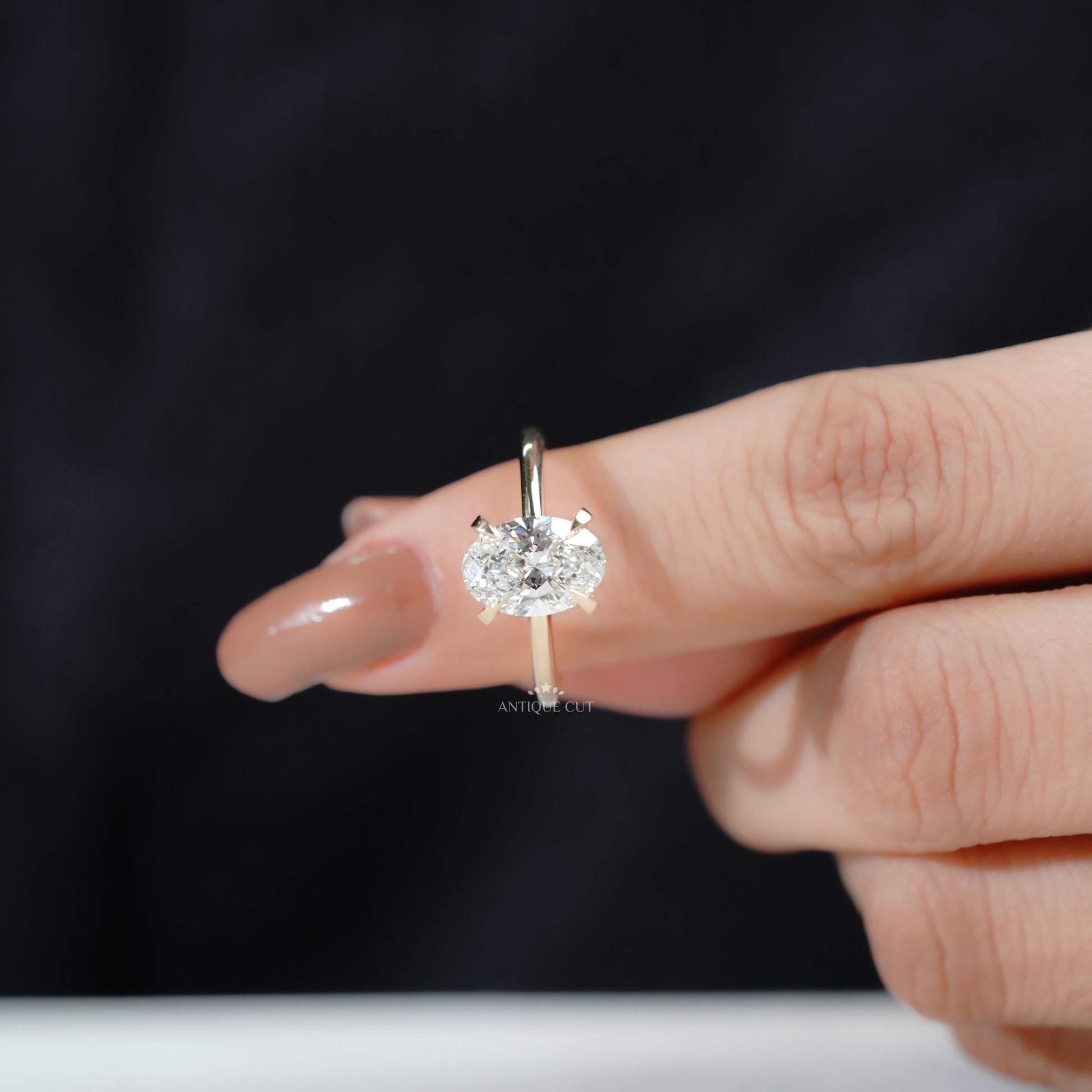 Sparkling oval engagement ring hidden halo