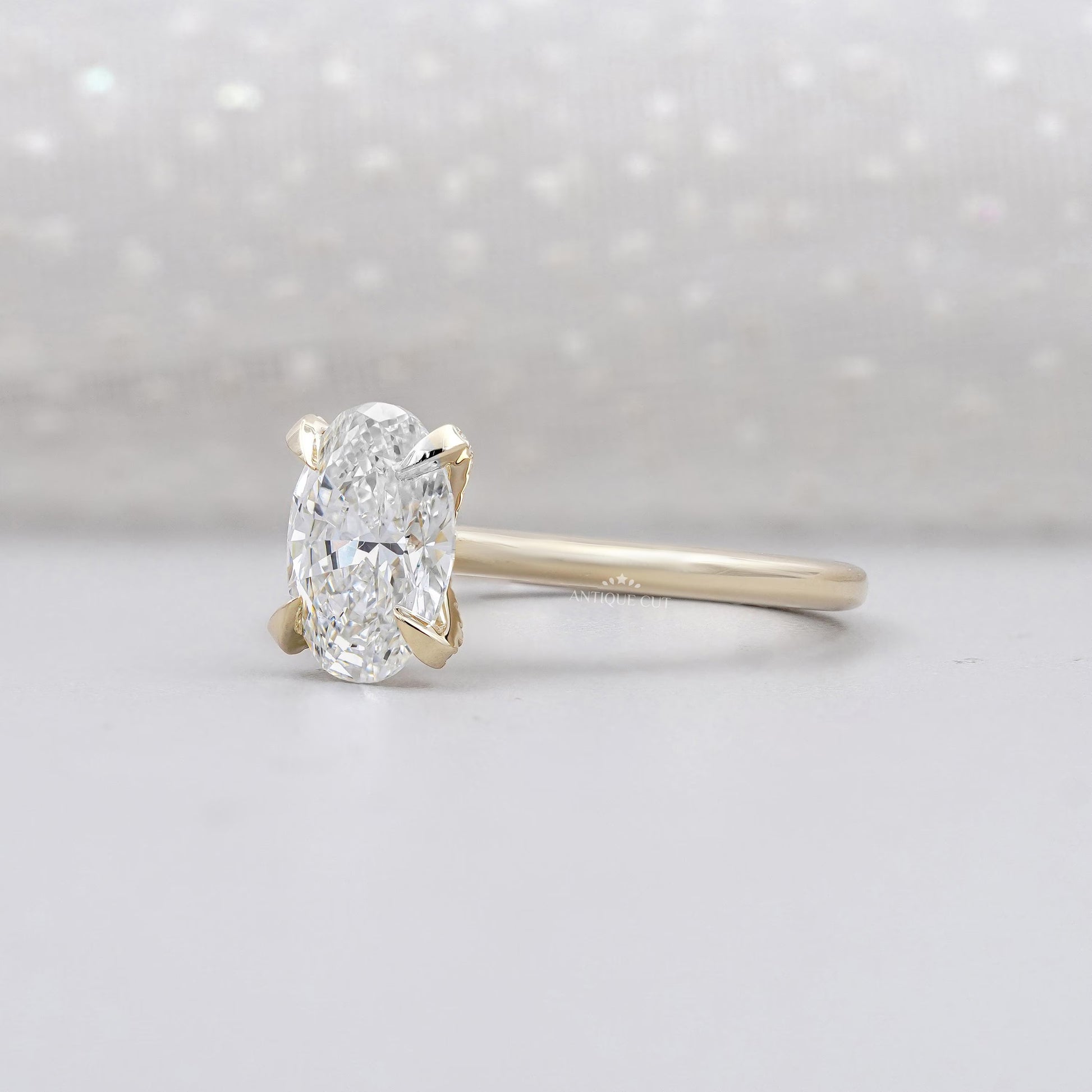 Yellow gold oval engagement ring side view halo