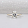 Hidden halo oval engagement ring in yellow gold