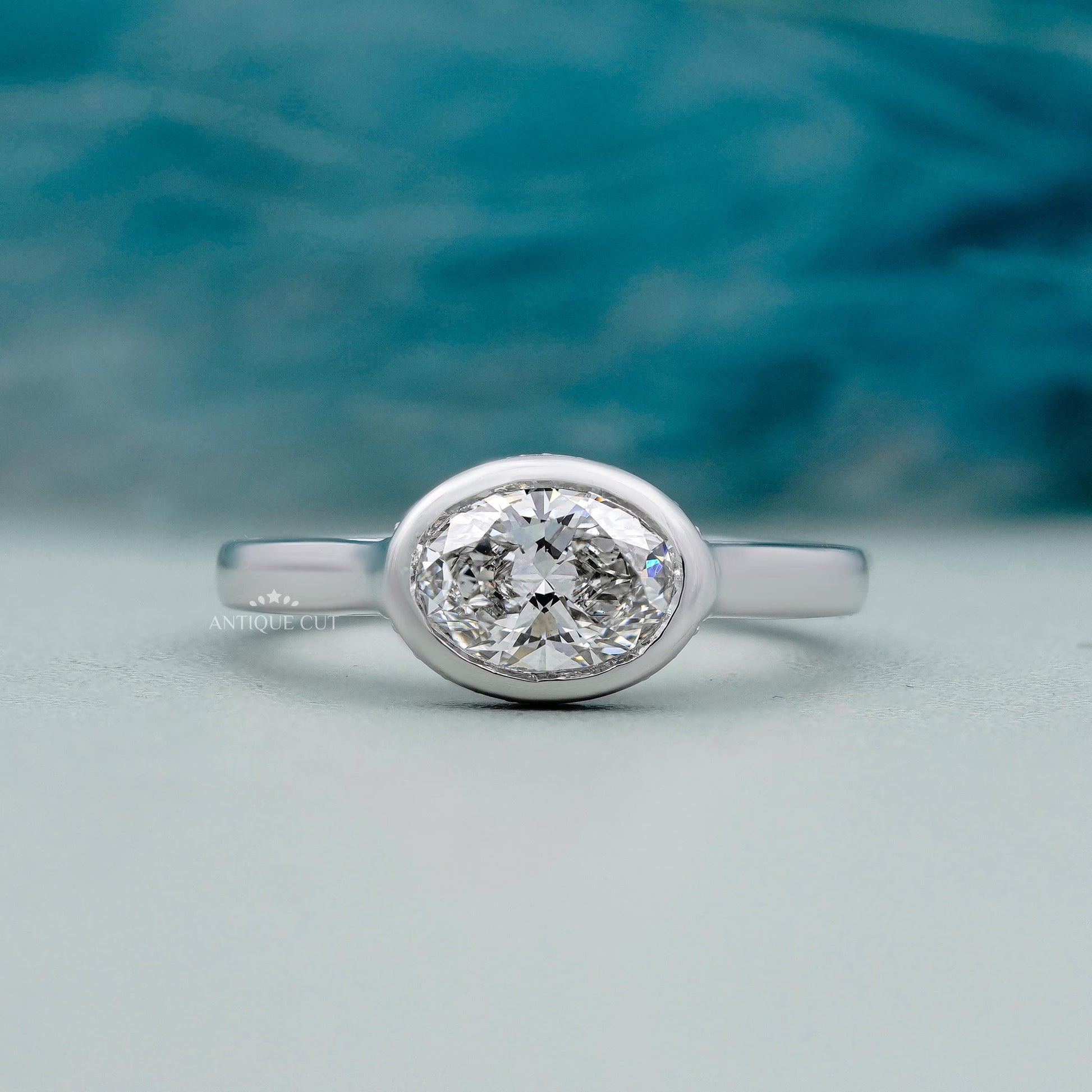 Oval diamond engagement ring east west setting white gold